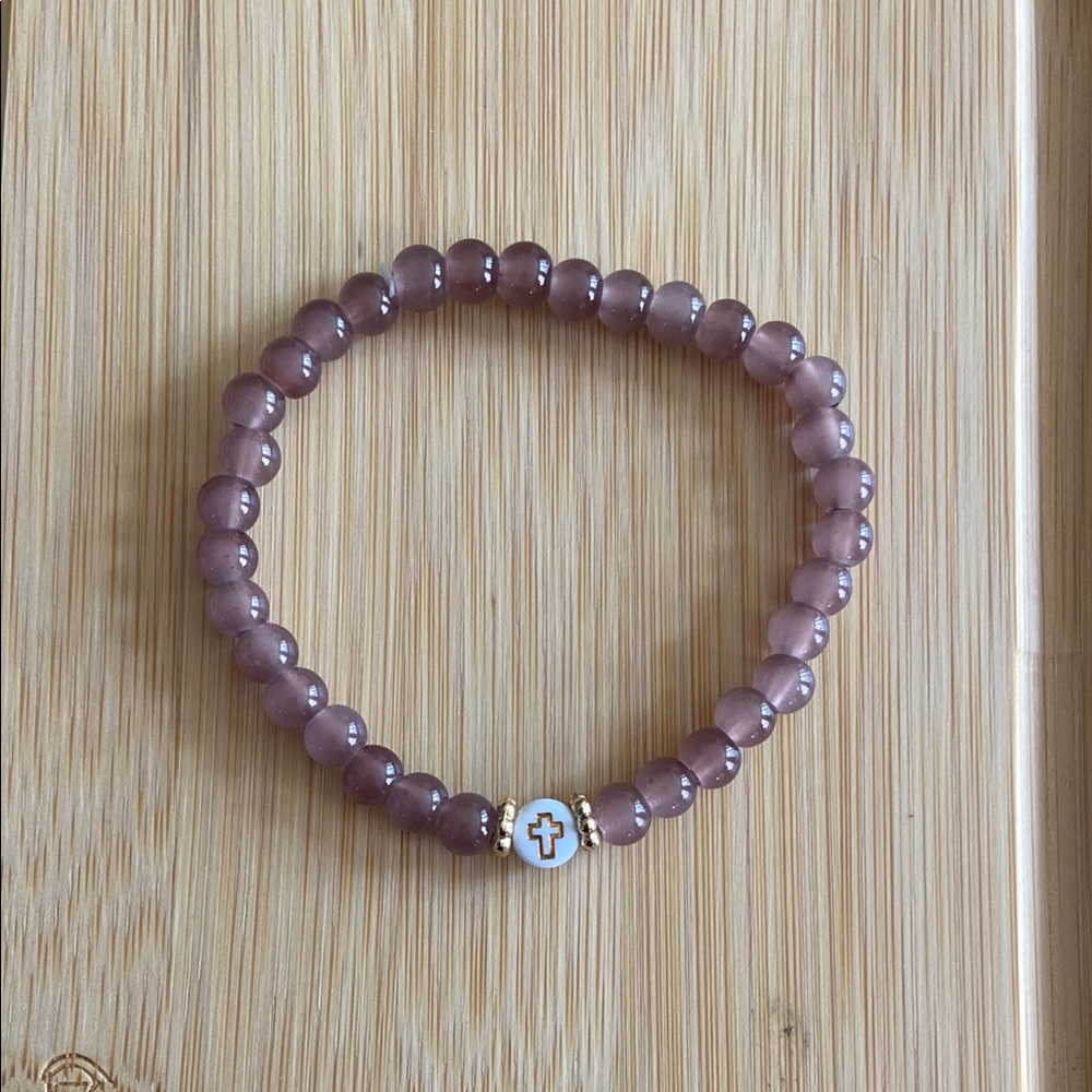 Handmade Brown glass bead bracelet with a cross charm.